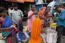 India, West Bengal, Kolkata, Malik Ghat flower market.