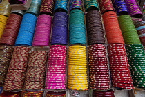 India, West Bengal, Kolkata, Bangles on display in a shop in the Bara Bazar district.