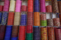 India, West Bengal, Kolkata, Bangles on display in a shop in the Bara Bazar district.