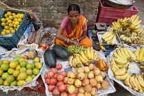 India, West Bengal, Kolkata, Fruit vendor at the market in the Garia district.