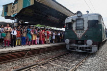 India, West Bengal, Kolkata, A train arrives at the platform at Garia Railway Station.