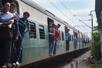 India, West Bengal, Kolkata, An overcrowded train at Garia Railway Station.