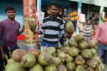 India, Bihar, Gaya, Coconut vendor.