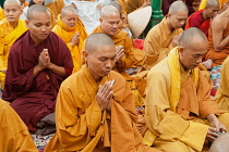 India, Bihar, Bodhgaya, Buddhist monks praying at the Mahabodhi Temple at Bodh.