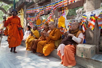 India, Bihar, Bodhgaya, Pilgrims pray at the Mahabodhi Temple at Bodh.