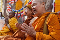 India, Bihar, Bodhgaya, Pilgrims pray at the Mahabodhi Temple at Bodh.