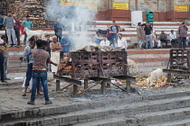India, Uttar Pradesh, Varanasi, A funeral pyre at Harishchandra Ghat.