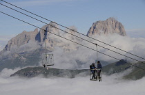 Italy, Trentino Alto Adige, Marmolada, view across to Sasso Lungo mountain range with bucket lift.