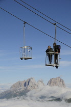 Italy, Trentino Alto Adige, Marmolada, view across to Sasso Lungo mountain range with bucket lift.