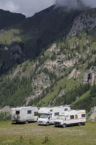 Italy, Trentino Alto Adige, Marmolada, campervans nr lake Fedaia.