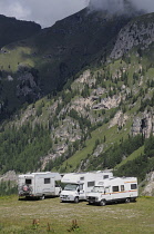 Italy, Trentino Alto Adige, Marmolada, campervans nr lake Fedaia.