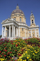 Italy, Piedmont, Turin, Basilica Superga with flowering garden in foreground.