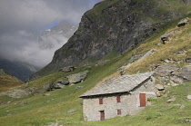 Italy, Piedmont, Val di Viu, farm buildings at Lago di Malciaussia.