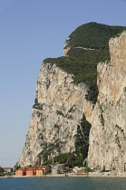 Italy, Lombardy, Lake Garda, steep cliffs fall into lake at Campione del Garda.