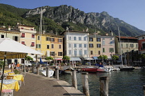 Italy, Lombardy, Lake Garda, Gargnano, harbourside with cafes.
