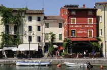 Italy, Veneto, Lake Garda, harbour front with cafes.