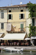 Italy, Veneto, Lake Garda, harbour front with cafes.