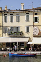 Italy, Veneto, Lake Garda, harbour front with cafes.