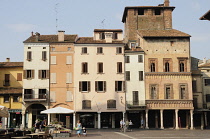 Italy, Lombardy, Mantova, arcade & old buildings on Piazza delle Erbe.
