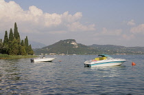 Italy, Lombardy, Lake Garda, San Vigilio, bathing & boating at Punta di San Vigilio.