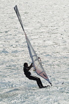 Italy, Lombardy, Lake Garda, windsurfing on the lake.
