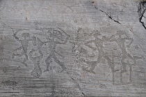 Italy, Lombardy, Valcamonica, Foppi di Nadro, 1000BC rock carvings depicting battles.