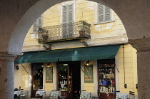 Italy, Piemonte, Lago d'Orta, Street scene through arcade, Orta San Guilio.