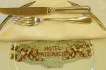 Italy, Friuli, Venezia Giulia, Aquileia, Hotel Patriarchi Restaurant, plate setting.