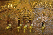 Italy, Trentino, Alto Adige, Trento, Birreria Pedavena copper beer pump.