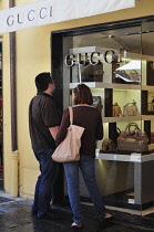 Italy, Liguria, Portofino, window shopping at Gucci.