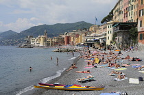 Italy, Liguria, Camogli, beach scene & waterfront.