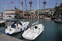 Italy, Liguria, Genoa, Porto Antico, harbour with yachts & pirate ship.