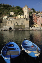 Italy, Liguria, Cinque Terre, Vernazza, harbour with blue fishing boats.
