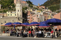 Italy, Liguria, Cinque Terre, Vernazza, alfresco dining on the waterfront.