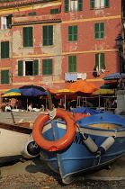 Italy, Liguria, Cinque Terre, Vernazza, harbour cafe with fishing boat.