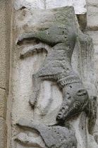 Italy, Lombardy, Pavia, relief figure of a dog, Church of San Michele.