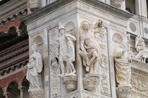 Italy, Lombardy, Pavia, relief detail on facade of Church of Our Lady of Graces.