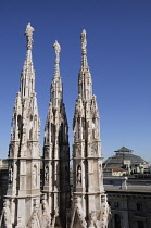 Italy, Lombardy, Milan, Duomo spires & rooftops of central Milan.