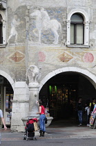 Italy, Trentino Alto Adige, Trento, wall painting & archways, Piazza Duomo.
