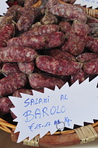 Italy, Piedmont, Alba, salami with Barolo wine.