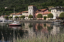 Italy, Lombardy, Lake Orta, Pella, Waterfront buildings and moored boats.