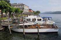 Italy, Lombardy, Lake Orta, Boats berthed along the lakefront, Orta San Giulio.