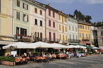Italy, Lombardy, Lake Orta, cafes lining Piazza Motta, Orta San Giulio.