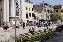 Italy, Veneto, Venice, Zattere, people walking along Fondamente Zattere beside Gesuati Church.