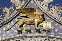 Italy, Veneto, Venice, Gold Lion of St Mark, Basilica San Marco facade.