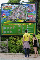 Italy, Lombardy, Lake Garda, Gardaland, couple reading the map.