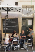 Italy, Lazio, Rome, Centro Storico, Campo dei Fiori, cafe life with family having lunch.