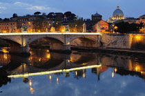 Italy, Lazio, Rome, Castel Sant'Angelo, night view from Ponte Sant'Angelo to St Peter's Basilica.