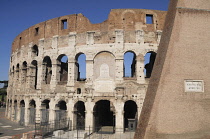 Italy, Lazio, Rome, Colosseum, view of Colosseum with brick wall.