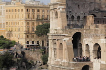 Italy, Lazio, Rome, Colosseum, cross section of the Colosseum with buildings of Monti area in distance.